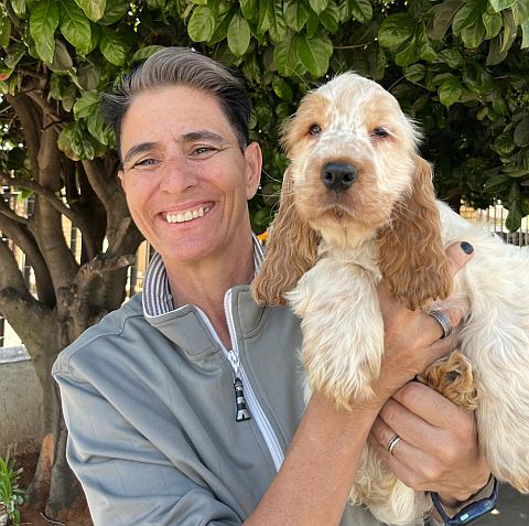 Olga holding puppy.